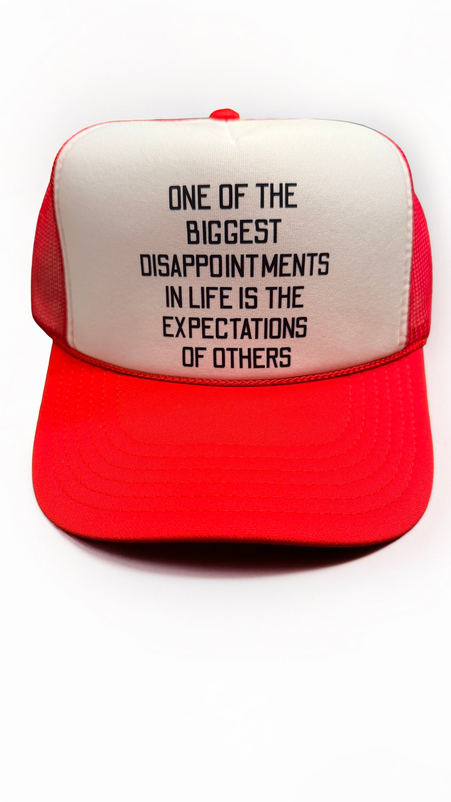 Red and white cap with motivational quote on a white background