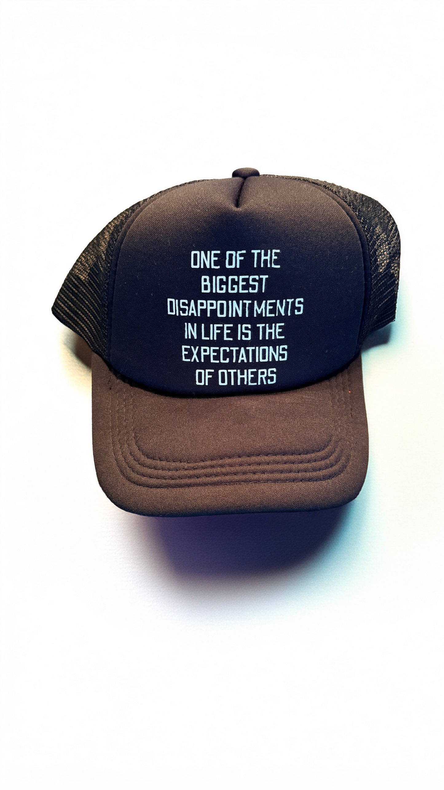 Black trucker hat with text on a white background